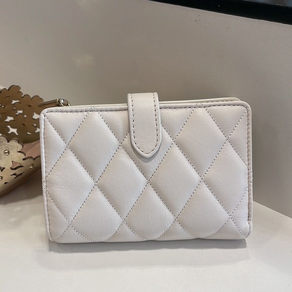 Kate Spade Carey Medium Compartment Bifold Wallet 
COLOR: Parchment - Picture 13 of 16